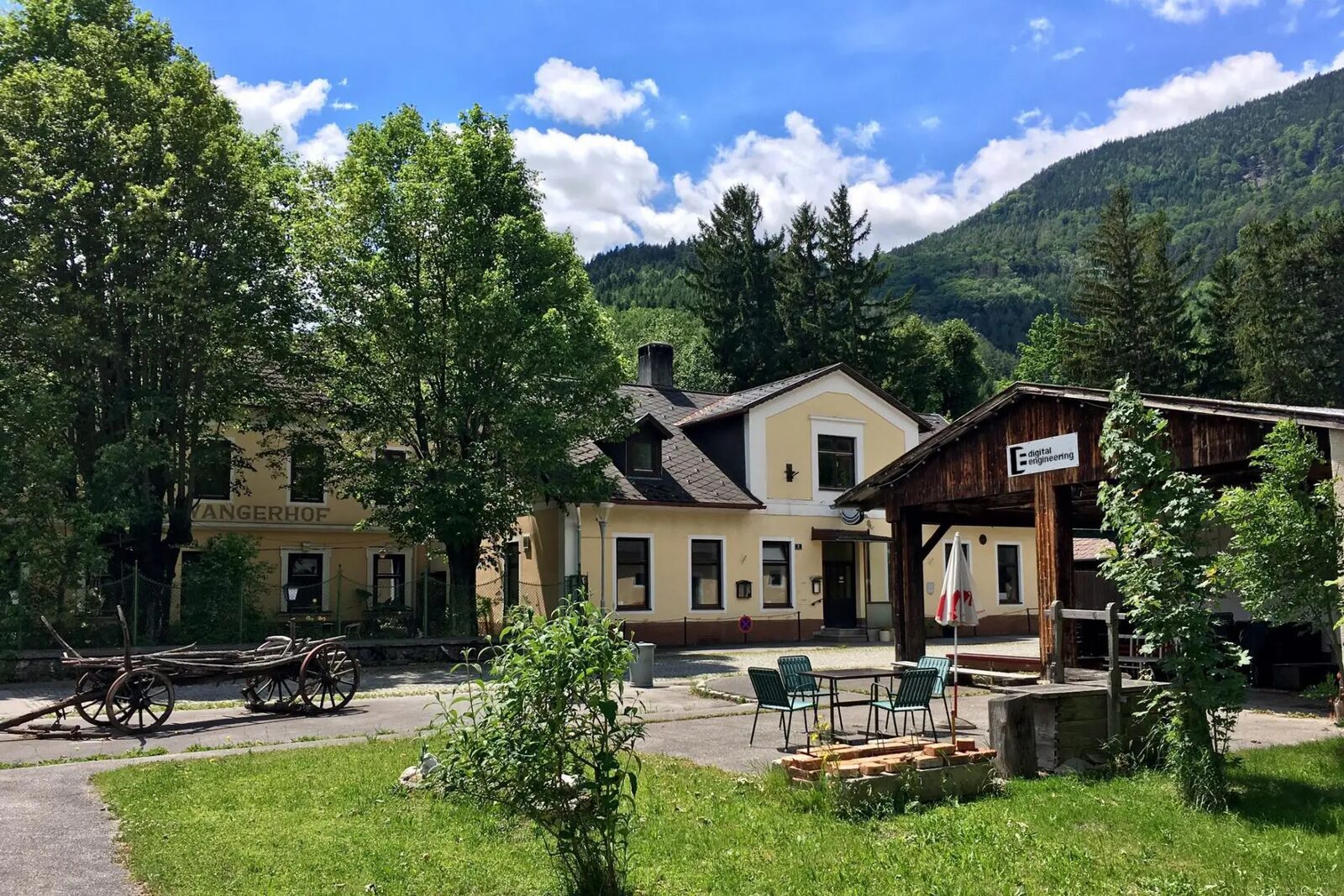 The Commons Hub in the Hirschwangerhof, the valley rising behind it
